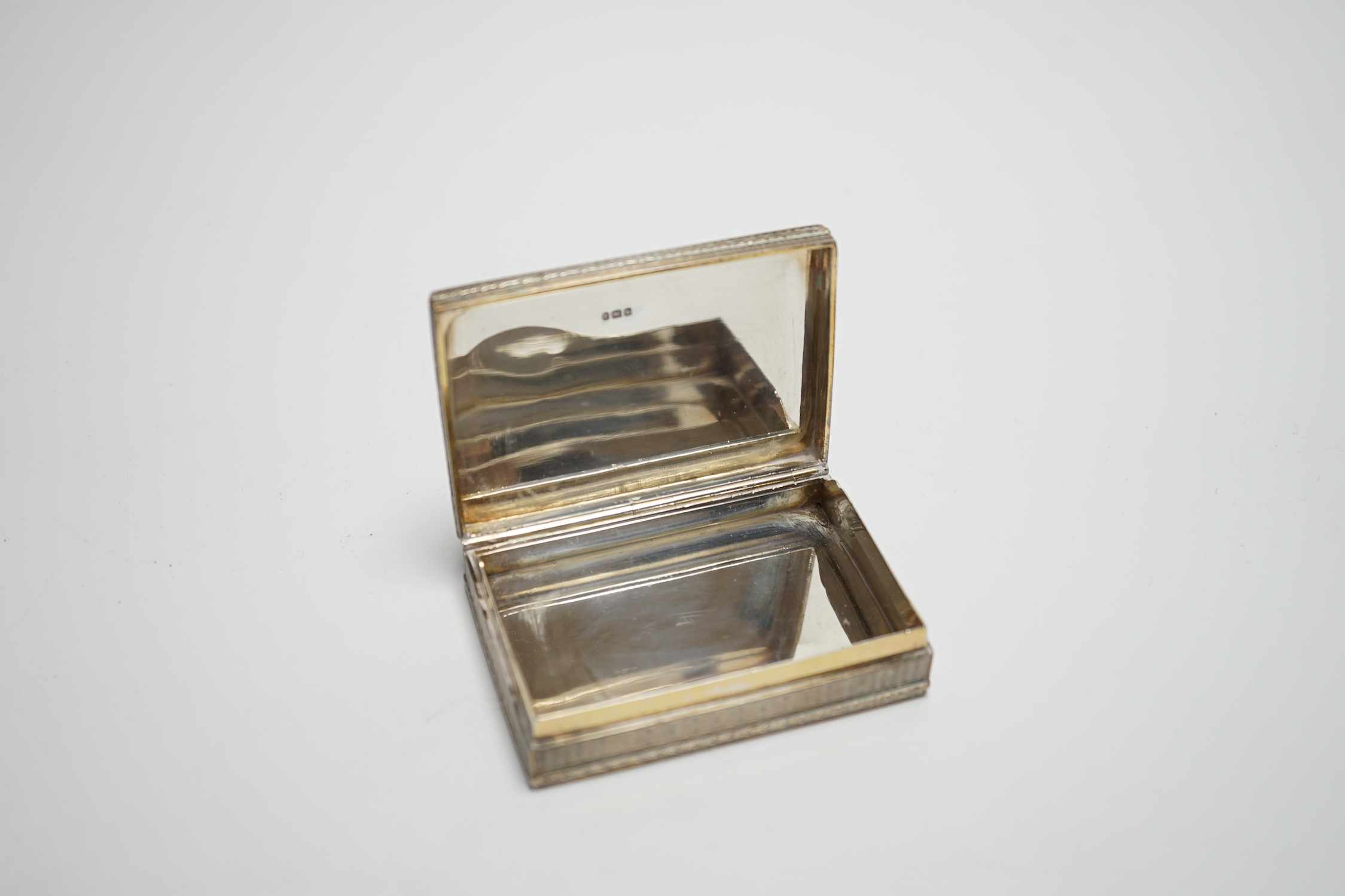 A late 19th century continental engine turned silver rectangular snuff box, import marks for Edwin Thompson Bryant, London, 1897, 78mm.